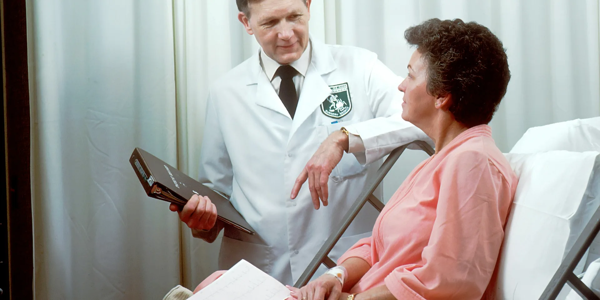 Physician consulting with a patient during a coordinated health screening